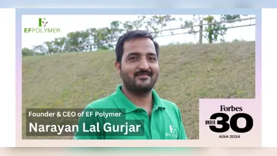Narayan Lal Gurjar in a field with the Forbes 30 Under 30 Asia 2024 seal